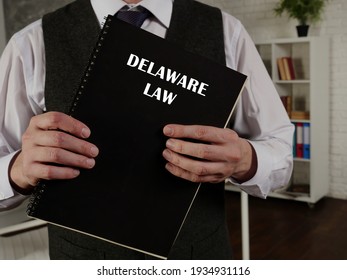 Attorney Holds DELAWARE LAW Book. Delaware Residents Are Subject To Delaware State And U.S. Federal Laws
