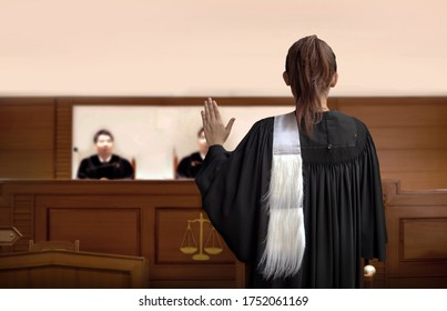 attorney woman on courtroom give swear words to magistrate in court room. Law and legal adjustment concept. The attorney communication on courthouse.