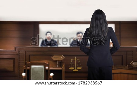 attorney woman on courtroom talking to magistrate in court box. for law and legal adjustment concept. The attorney communication on courtroom.