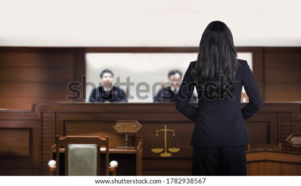 attorney woman on courtroom talking to\
magistrate in court box. for law and legal adjustment concept. The\
attorney communication on\
courtroom.