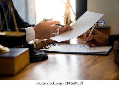 Attorneys or lawyers who are reading the statute of limitations Consultation between male lawyers and business clients, tax and legal and legal services firms. - Shutterstock ID 2141684553