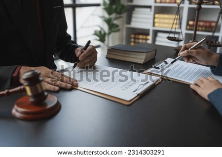 Attorneys or lawyers who are reading the statute of limitations Consultation between male lawyers and business clients, tax and legal and legal services firms.
