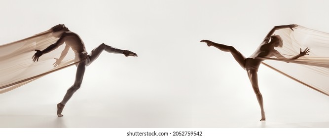 Attraction. Modern ballet dancers. Contemporary art. Young flexible athletic man and woman in transparent cloth in action. Concept of grace, inspiration, creativity, feeling, emotions and relationship - Powered by Shutterstock