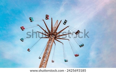 Attraction park. ride on a celestial carousel against the  sunset sky.