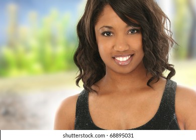 Attractive 20 Year Old African American Black Woman With Great Smile Outdoors.