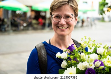 Attractive 35 Year Old White Woman Holding A Flower Bouquet