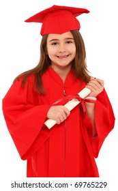 Attractive 7 Year Old Girl In Oversized Large Red Graduation Cap And Gown With Diploma Over White.