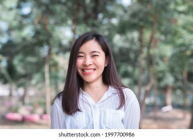 Attractive Adult Business Woman Asian Girl With Happy And Smile Standing On Walk Way Go To Working Between Her Office On Morning Under Green Forest.