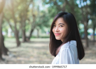 Attractive Adult Business Woman Asian Girl With Happy And Smile Standing On Walk Way Go To Working Between Her Office On Morning Under Green Forest.