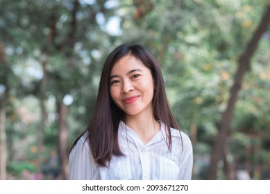 Attractive Adult Business Woman Asian Girl With Happy And Smile Standing On Walk Way Go To Working Between Her Office On Morning Under Green Forest.