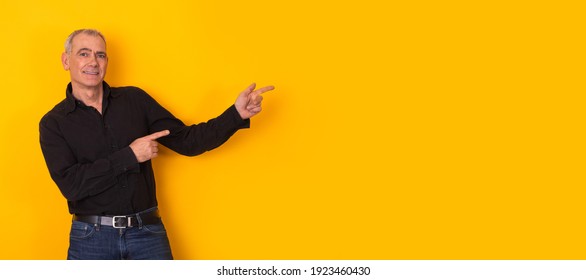 attractive adult man pointing isolated on background