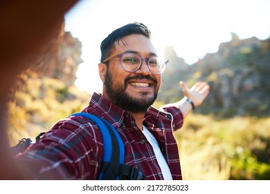 An Attractive Adult Man Takes A Follow Me Selfie In The Mountains Hiking