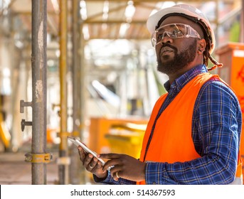 Attractive African American Engineer At Work On Construction Site