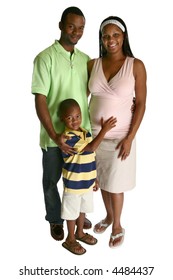 Attractive African American expecting parents over white background with son.