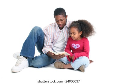 Attractive African American Man And Child Reading Together.