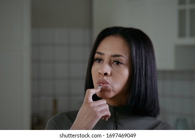 Attractive african american woman doubting and confused, thinking of an idea or worried about something, posed thoughtfully - Shutterstock ID 1697469049