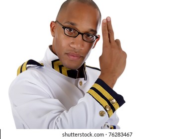 Attractive African American Young Male Cruise Ship Steward Gives Salute . Studio Shot. White Background.