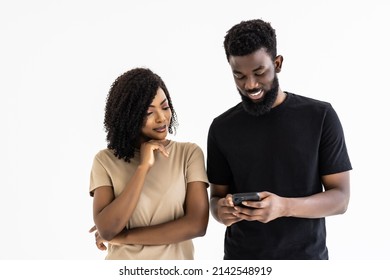 Attractive African Ethnicity Couple Hold Smart Phones Having Fun In Internet