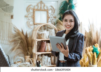 Attractive Asian Business Owner At Her Art And Craft Store Selling Goods Made Of Natural Product