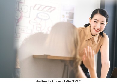 Attractive Asian Business Woman Leader In A Meeting With Her Teamwork Colleagues At The Office Brainstorm Presenting Sales Growth Strategy Data Or Forecast For A Project