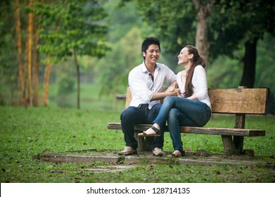 Attractive Asian Couple Dating In The Park