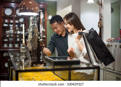 Attractive Asian Couple Shopping