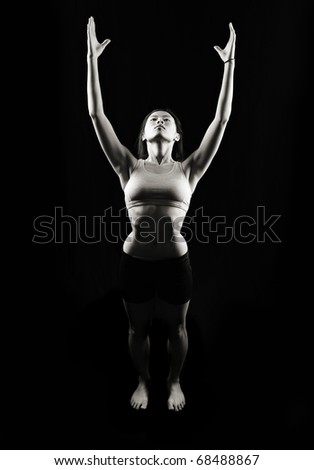 Similar – Rear view portrait of one young middle age athletic woman at crossfit training, exercising with trx suspension fitness straps over dark background