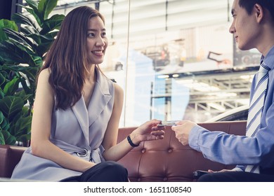 Attractive Asian Girl Millenials Buying A New Car With Credit Card. Film Effected. 