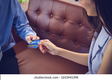 Attractive Asian Girl Millenials Buying A New Car With Credit Card. Film Effected. Close-up Scene