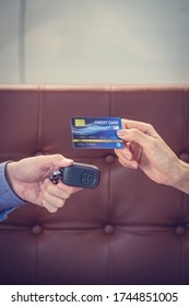 Attractive Asian Girl Millenials Buying A New Car With Credit Card. Film Effected. Close-up Scene