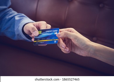 Attractive Asian Girl Millenials Buying A New Car With Credit Card. Film Effected. Close-up Scene