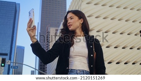 Similar – Young asian woman taking photo with her smartphone