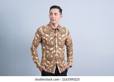 Attractive Asian men have different emotions wearing Indonesian batik clothes