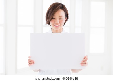 Attractive Asian Nurse  Holding Blank White Board