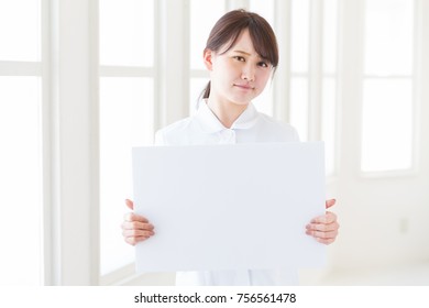 Attractive Asian Nurse  Holding Blank White Board,think,