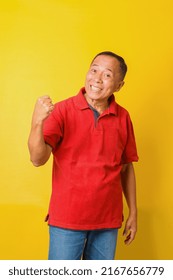 Attractive Asian Senior Man Wearing Casual Shirt Celebrating Surprised And Amazed For Success With Arms Raised And Beamed Teeth. Yes, Oh Yeah Moment. 