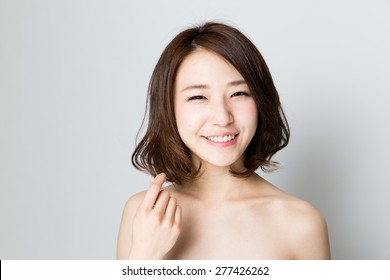 attractive asian woman beauty image on gray background