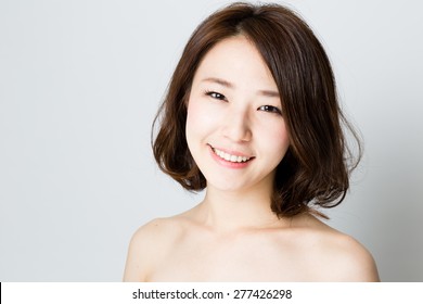attractive asian woman beauty image on gray background