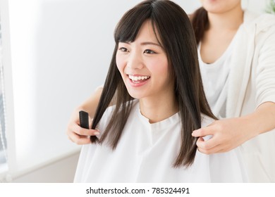 Attractive Asian Woman In Hair Salon