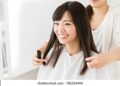 Attractive Asian Woman In Hair Salon