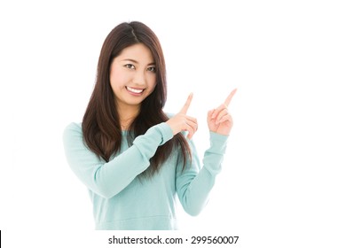 attractive asian woman showing isolated on white background - Shutterstock ID 299560007