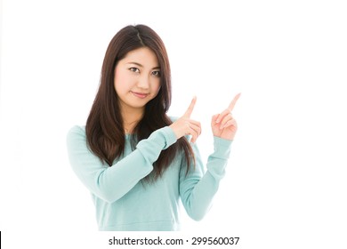 attractive asian woman showing isolated on white background - Shutterstock ID 299560037