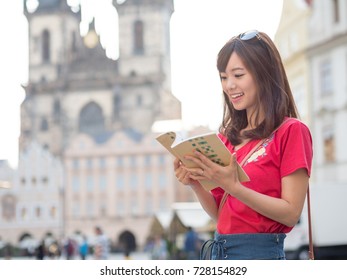 attractive asian woman traveling in europe - Shutterstock ID 728154829