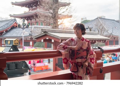 Attractive asian woman wearing kimono at Sensoji Asakusa Temple, Tokyo, Japan