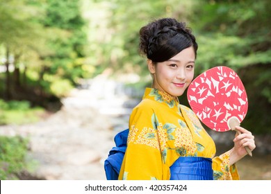 Attractive Asian Woman Wearing Traditional Japanese Casual Summer Kimono Called 