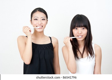 Attractive Asian Women Brushing Her Teeth