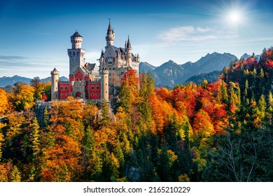 Attractive autumn scene of Neuschwanstein Castle, 19th-century hilltop fairytale castle. Incredible morning scene of Bavaria. Impressive landscape of Alps, Germany. Traveling concept background.