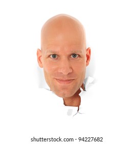 Attractive Bald Man Breaks His Head Trough White Paper Wall. All On White Background.