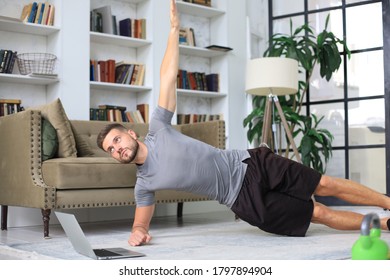 Attractive Beared Man Doing Plank Exercise At Home. Fitness Is The Key To Health.