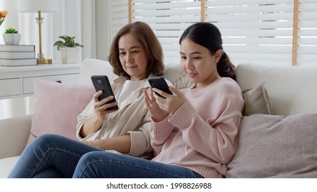 Attractive Beautiful Asian Family Sit Sofa Couch Living Room Enjoy Urban Life Joyful Promotion Discount Shop Buy Health Care Insurance Online Quarantine Activity Isolate Omnichannel Experience At Home